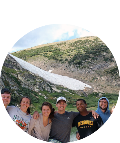 Tim Murphy fun photo with a group of friends at a mountain lake in summer with snow melt.