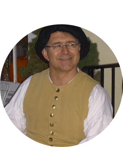 Joseph Demshar photo posing in costume vest of Rennaissance style.