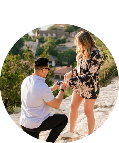 Dan Kim proposing while on knee placing ring on his fiancée's finger0