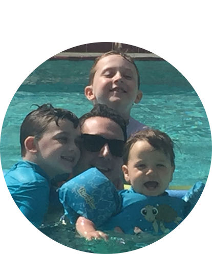 Matt Berenson in swimming pool with three children.