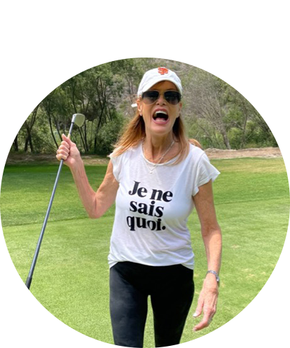 Frances Ouellette fun photo playing golf and smiling.