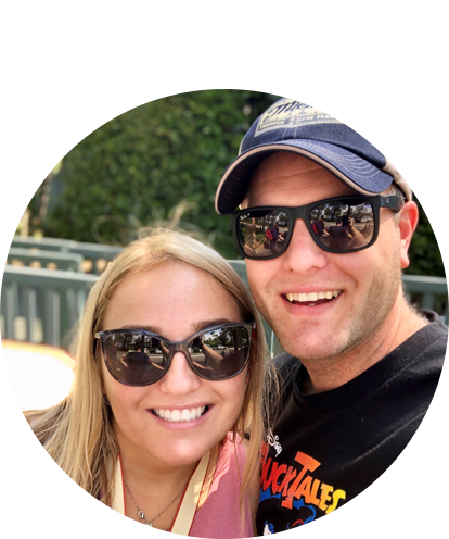 Brian Stith fun photo posing with adult female smiling and wearing sunglasses.