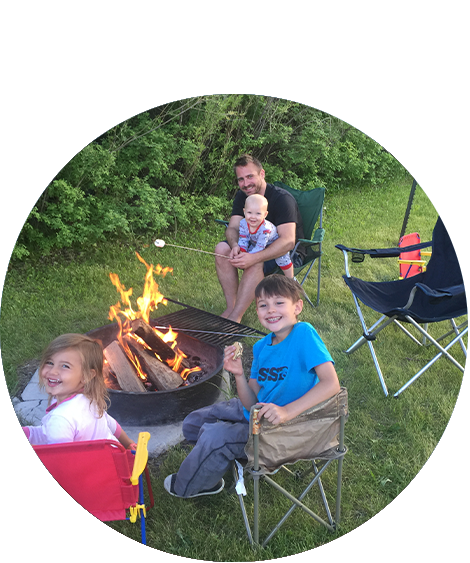 Man with family camping