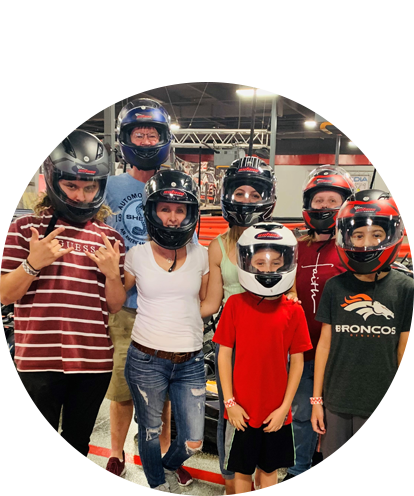 Laurie Marin fun photo with family outing wearing race helmets.