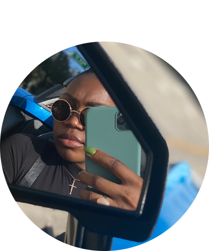 Sharta Way selfie taken in rear view mirror of car.