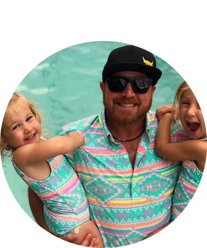 Garin Hamberger fun photo in pool holding two small girls in each arm.