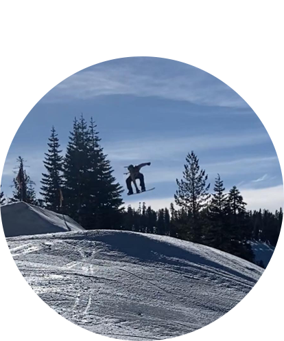 Hunter Schlampp fun photo (human snowboarding on sunny day make a big jump in the air).