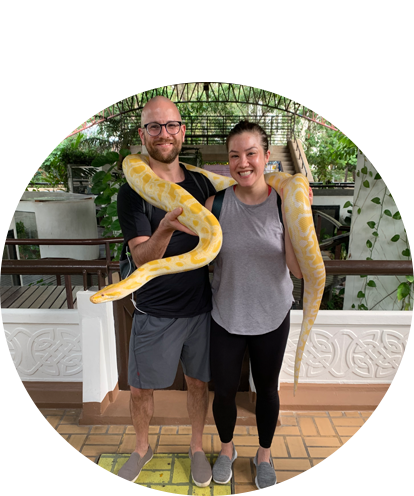 Jess Blair fun photo (adult female and adult male posing with over 10 foot long yellow snake).