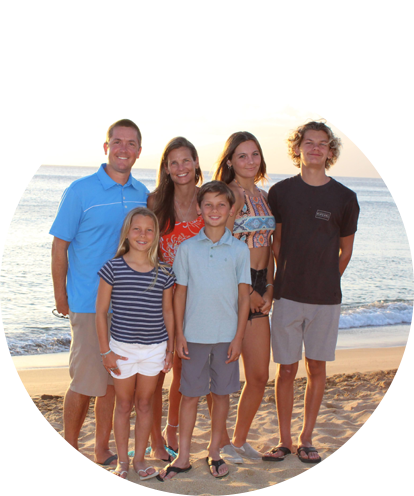 Tim Goode fun photo (family beachside portrait with two adults and three children of various ages).