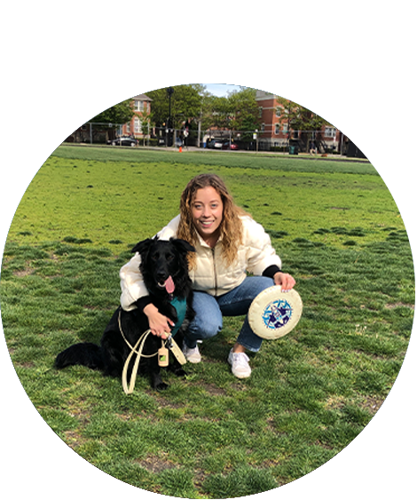woman holding frisbee with dog