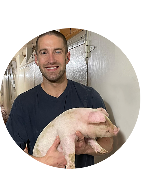 Man holding a pig