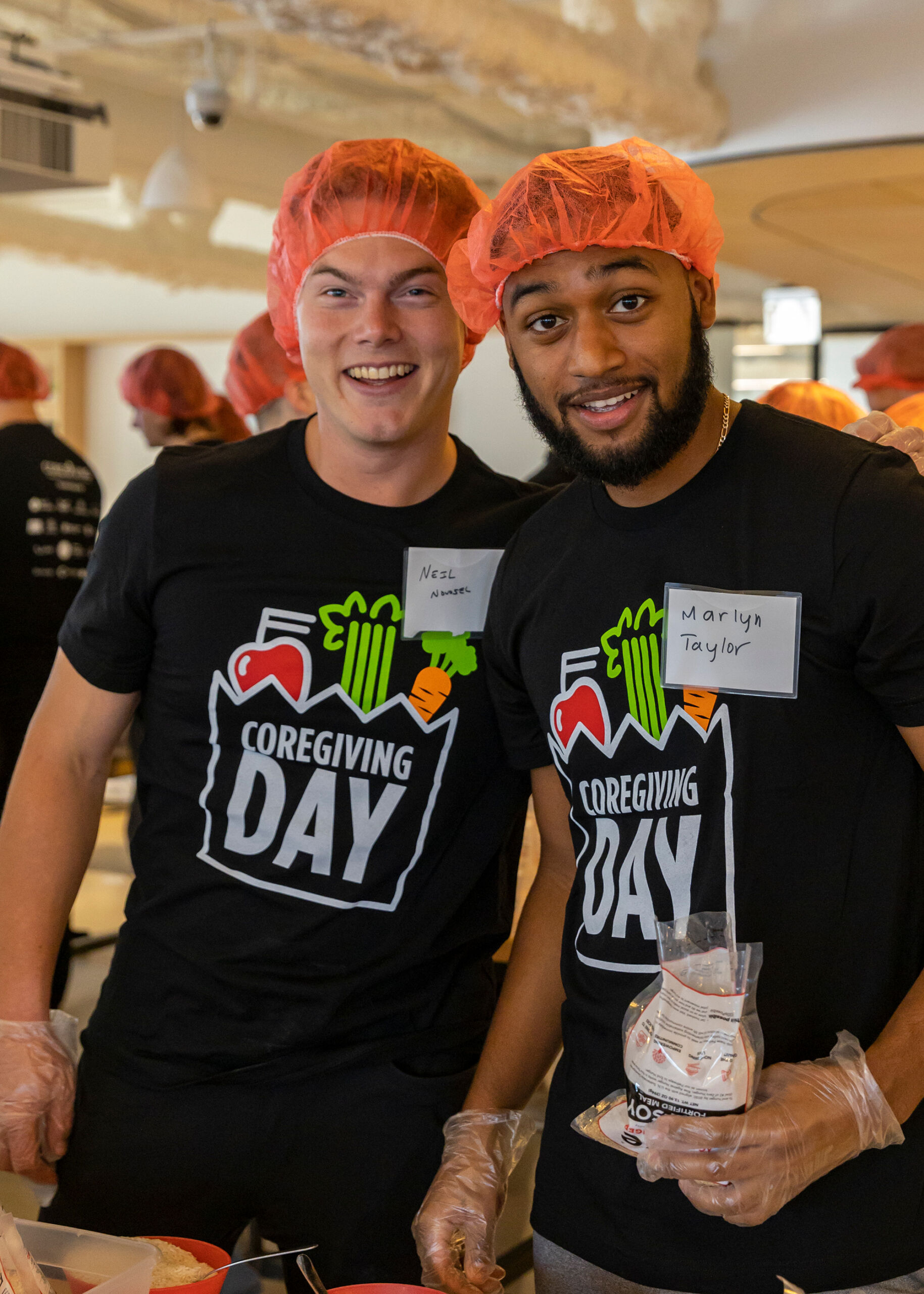 two men in coregiving t shirts