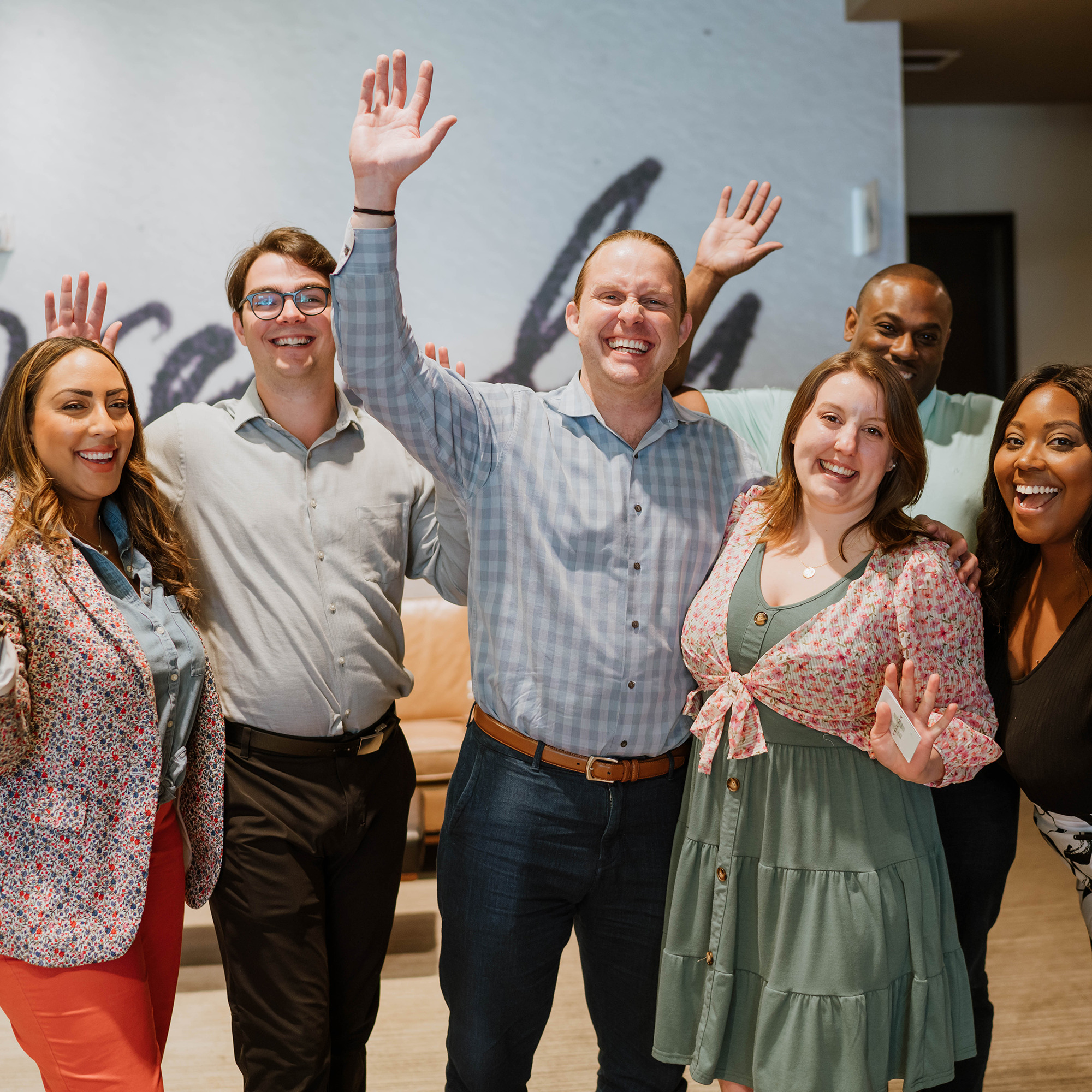 Group of people waving