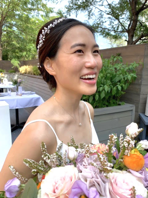 woman smiling with flowers